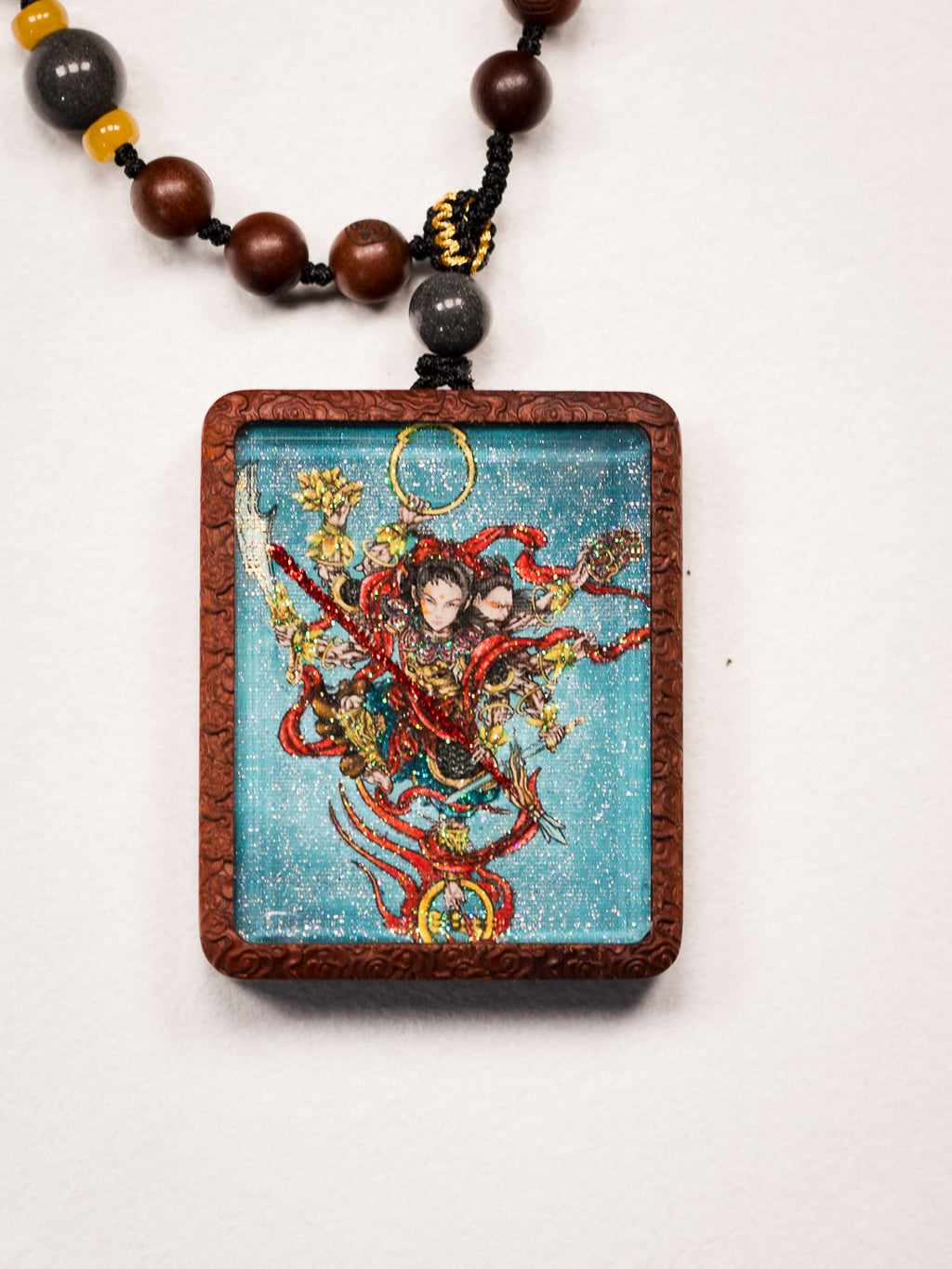 手绘点彩 哪吒 枣木外壳 小吊坠唐卡
